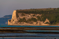 Sunrise light bathing White Cliff Bay