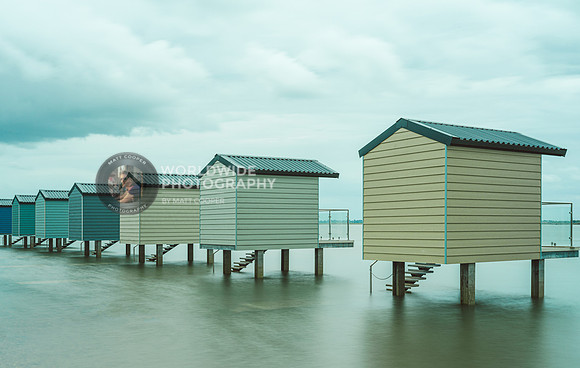 Beach huts at high tide